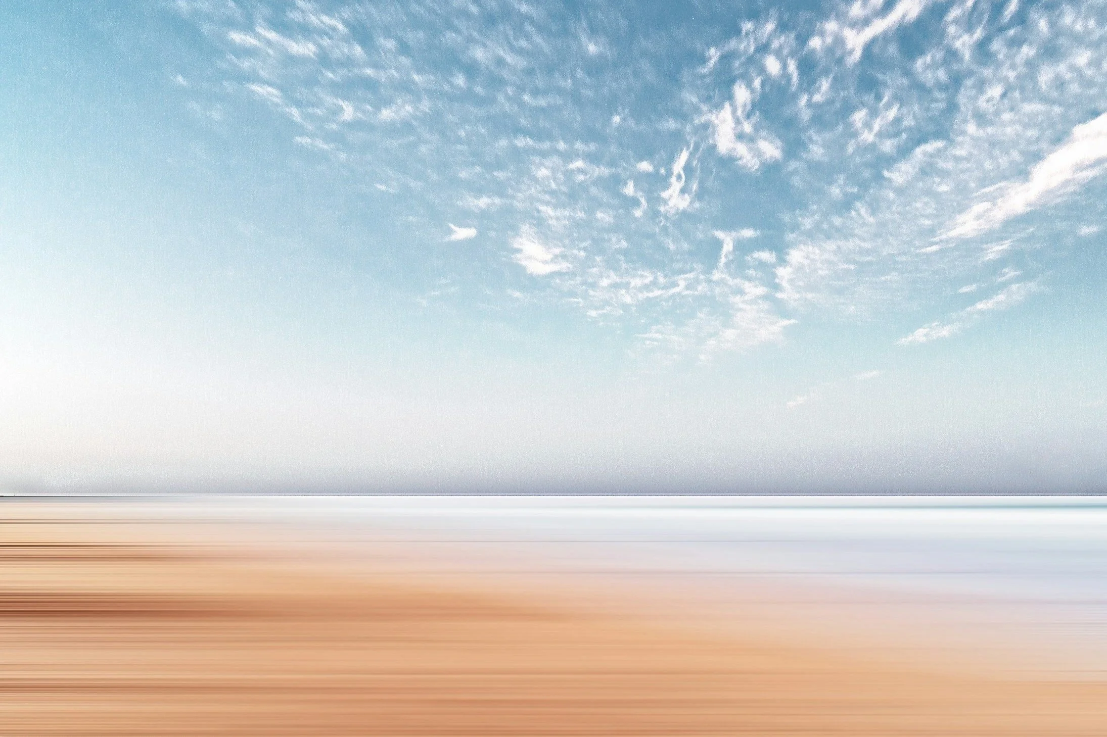 Thread Studio Brand Roles - The Visionary: Blurred photo of a sky with scattered clouds and a horizon.