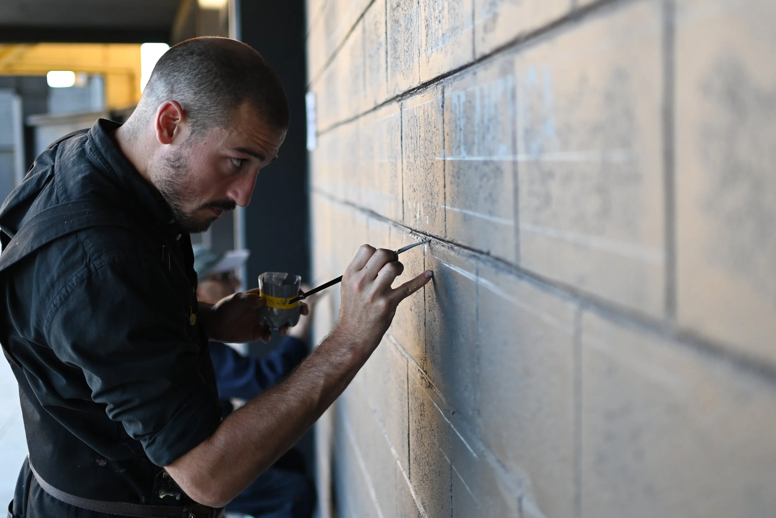 Gastón painting a mural for Peñarol