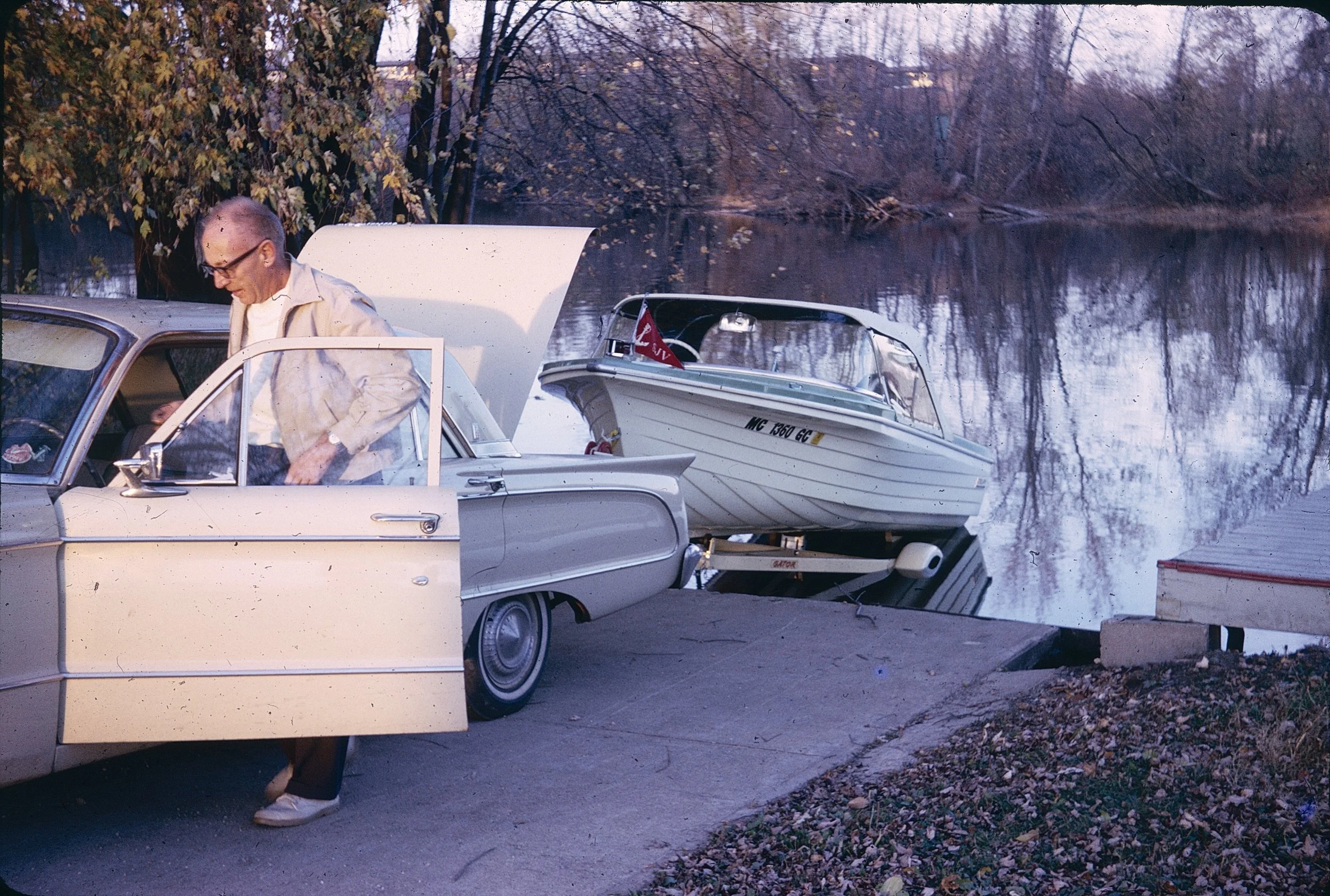 A digitized 35mm slide of Otto entering his car circa 1964.