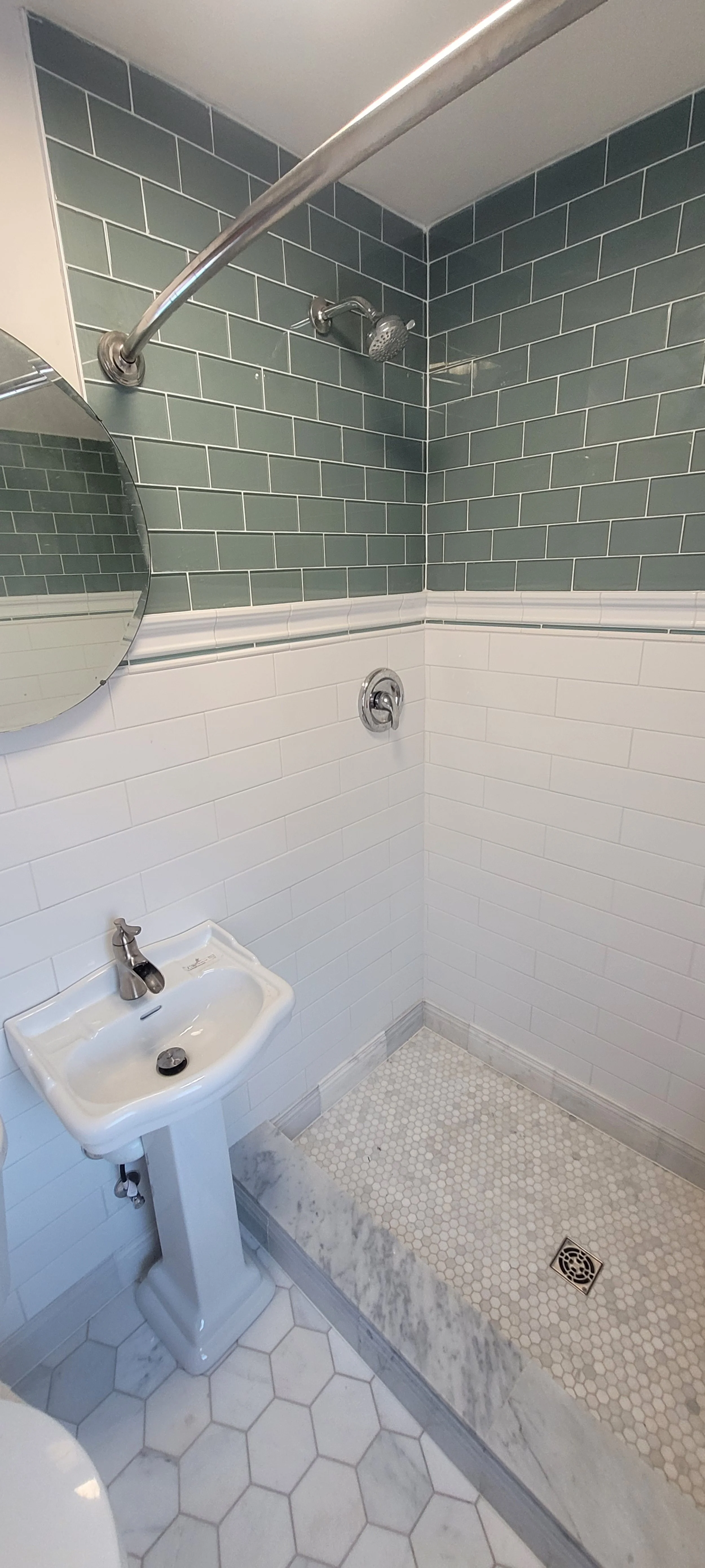 Cleveland, Ohio: Full Bathroom Remodel (After) New tile on floor, shower stall, and walls, new lighting, fixtures, trim, and paint