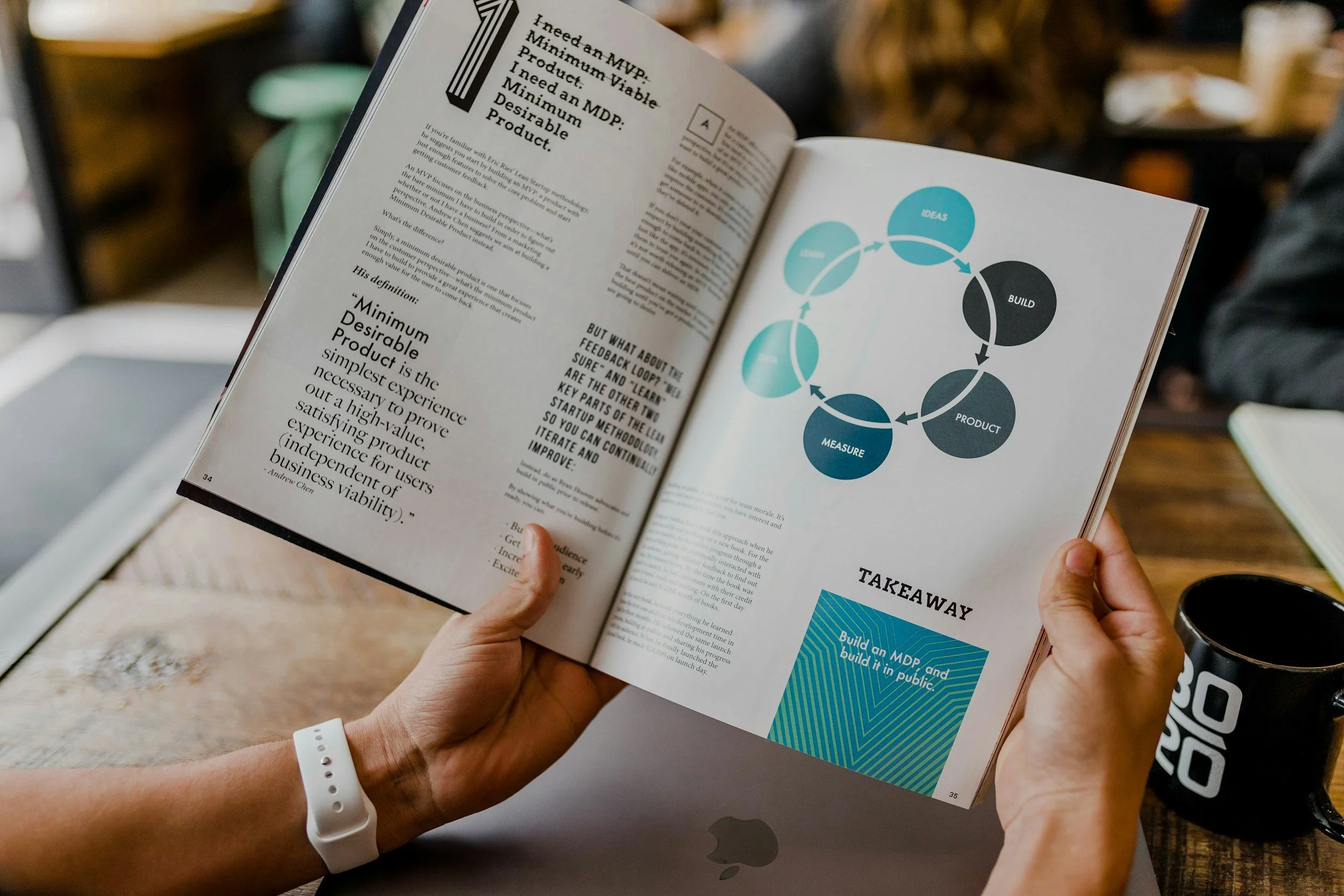 hands holding an annual report booklet