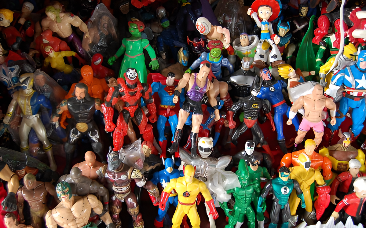 A large collection of colorful action figure toys featuring characters from superhero, cartoon, and movie franchises arranged in a pile.