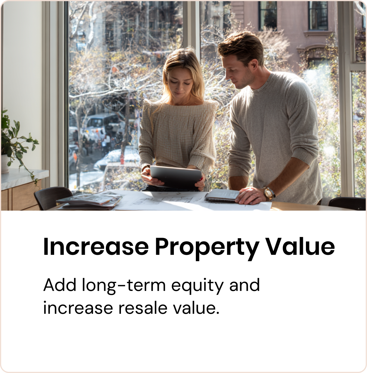 Homeowners reviewing ADU plans to increase property value in NYC