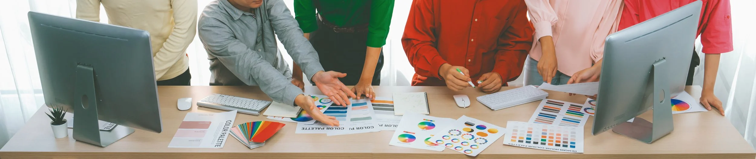 A team looking at brand colours during website design for Tyrone Marketring