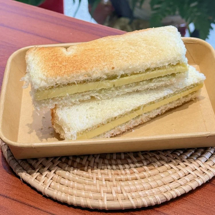 Crispy toasted Roti Bakar with kaya jam and thick butter slice at LemakBox Chinatown KL