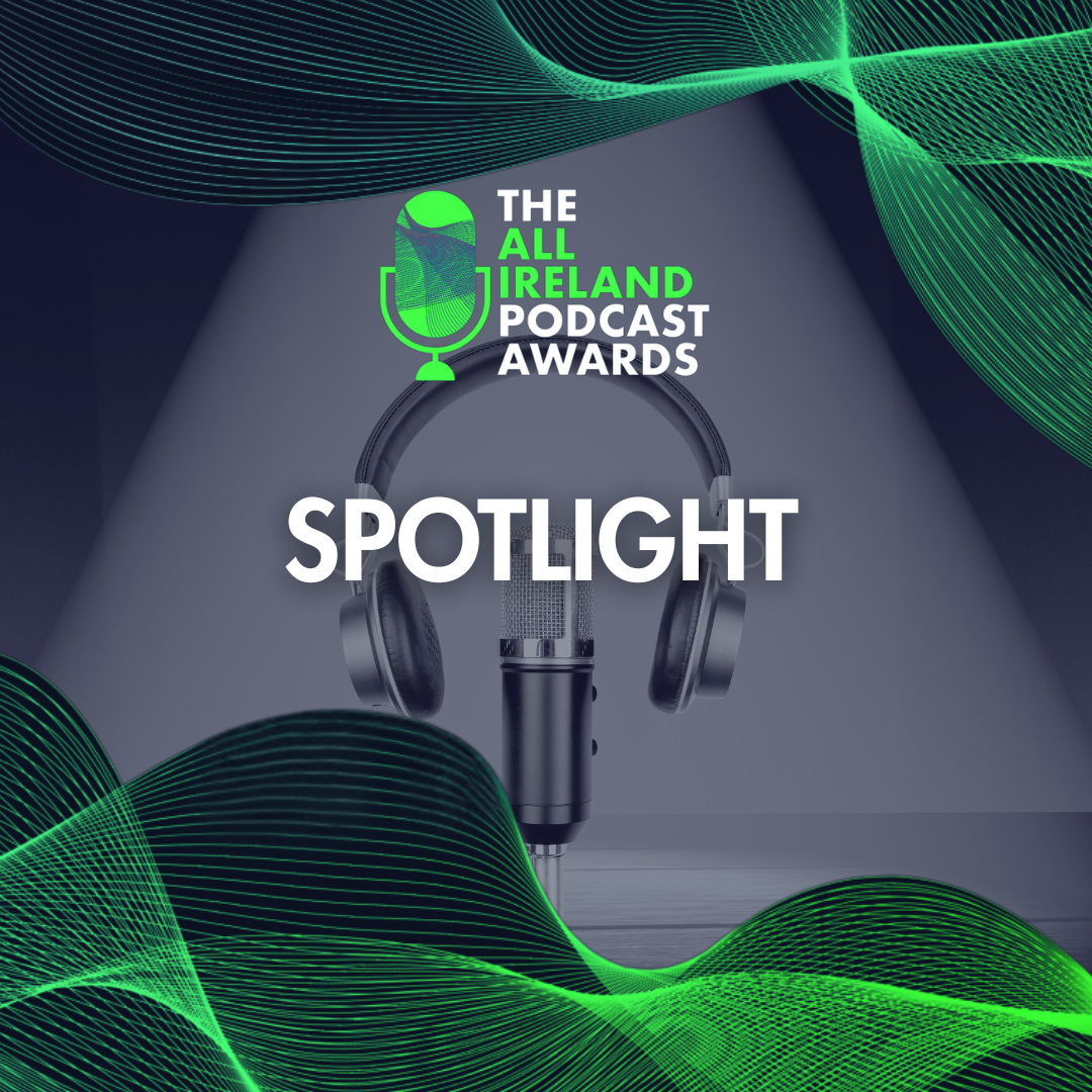 Podcast microphone with headphones on a table, spotlight shining on it, with green and black wave patterns in the background, promoting The All Ireland Podcast Awards Spotlight.