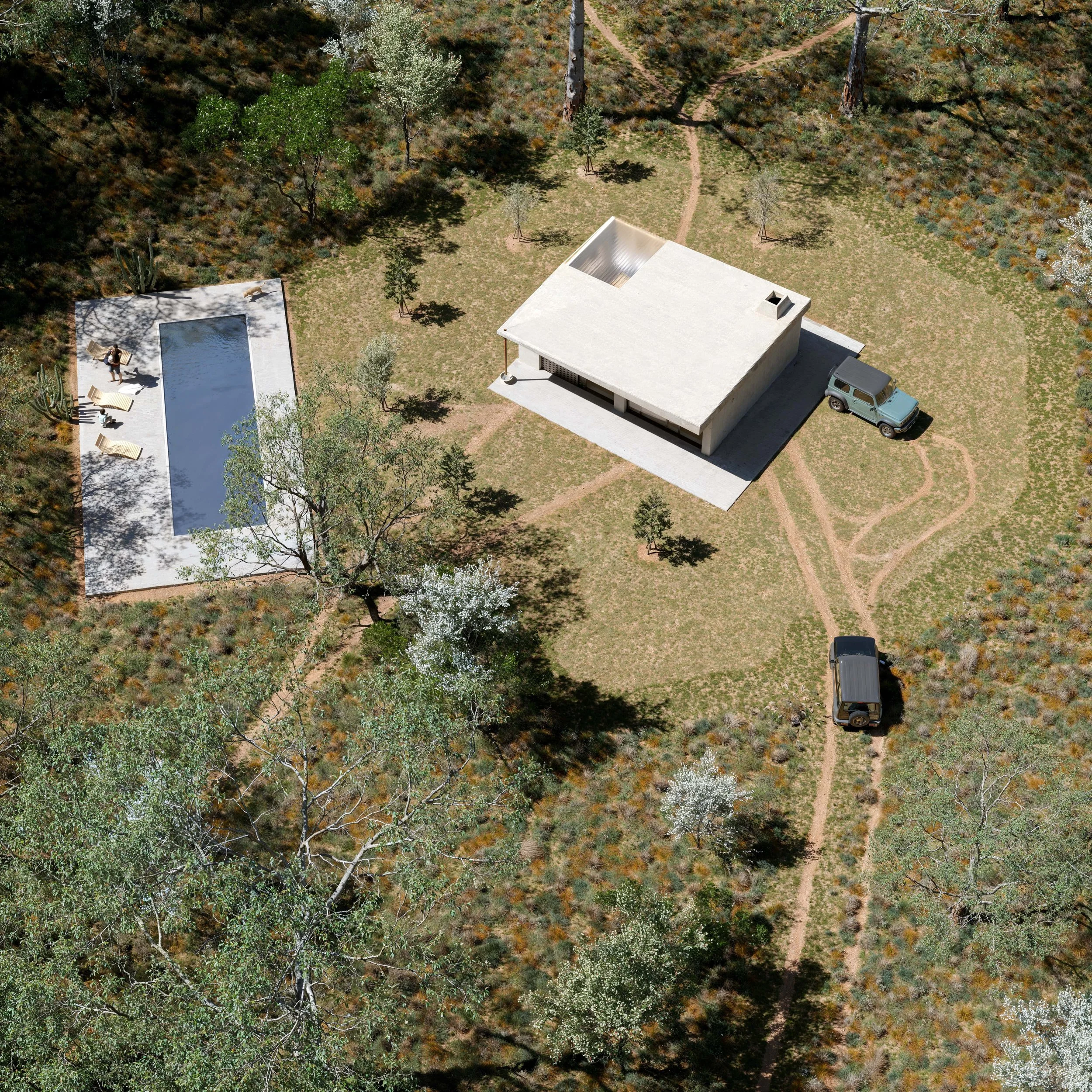 Aerial view of a modern house with a concrete exterior, surrounded by trees, with a driveway leading to two parked vehicles. There is a backyard with a rectangular swimming pool, lounge chairs, and a person sitting near the pool.
