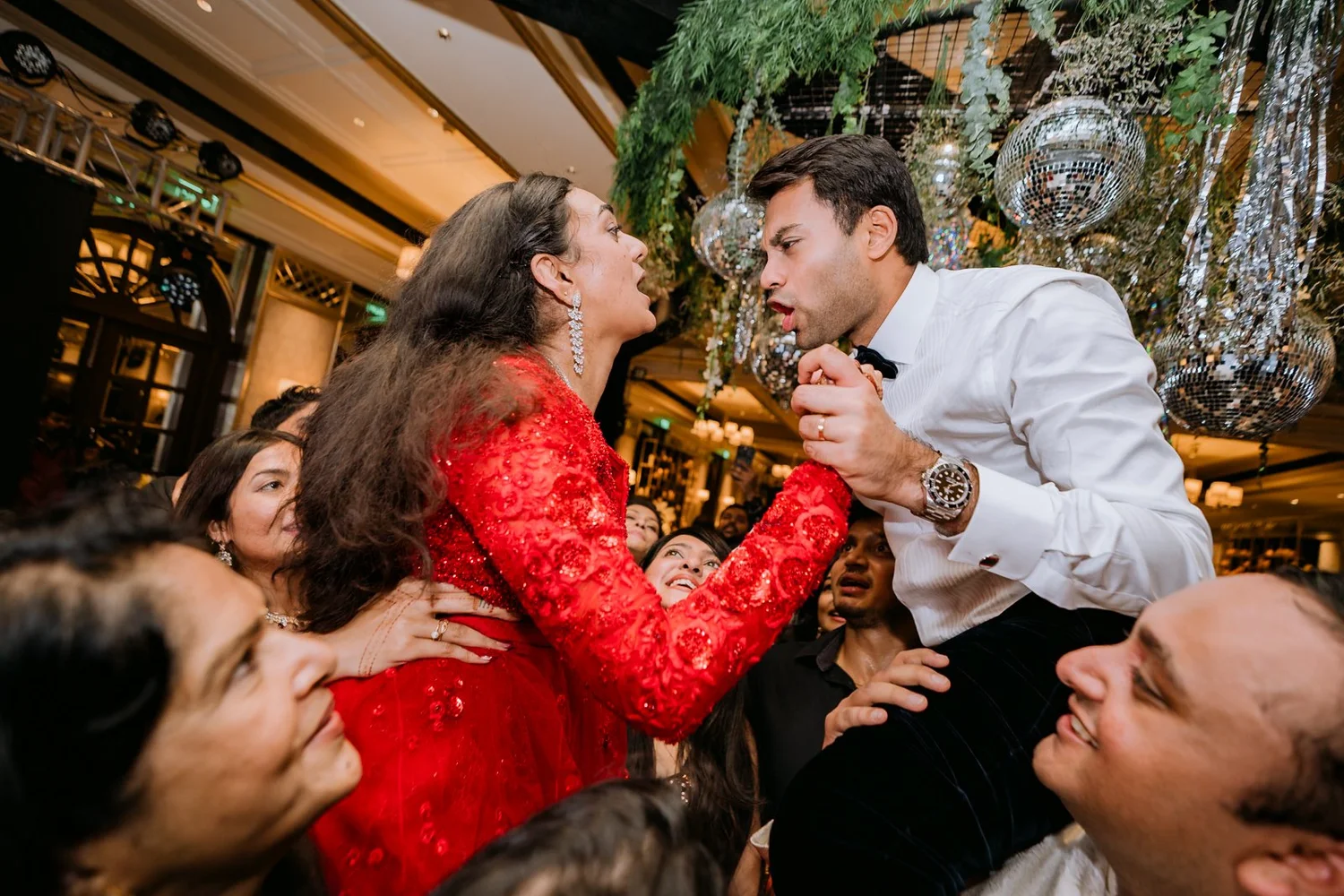Shrishti and Akhil lifted on friends' shoulders at the cocktail