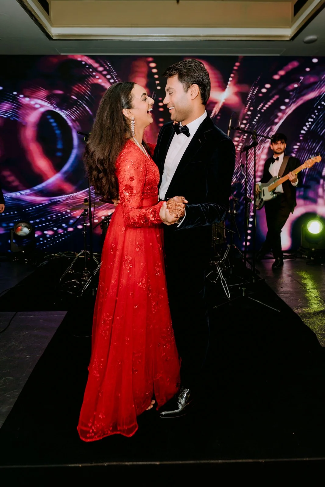 Shrishti in a red gown dancing with Akhil