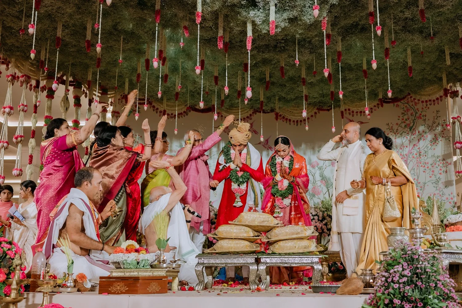 Families reaching out with blessings during the muhurtham