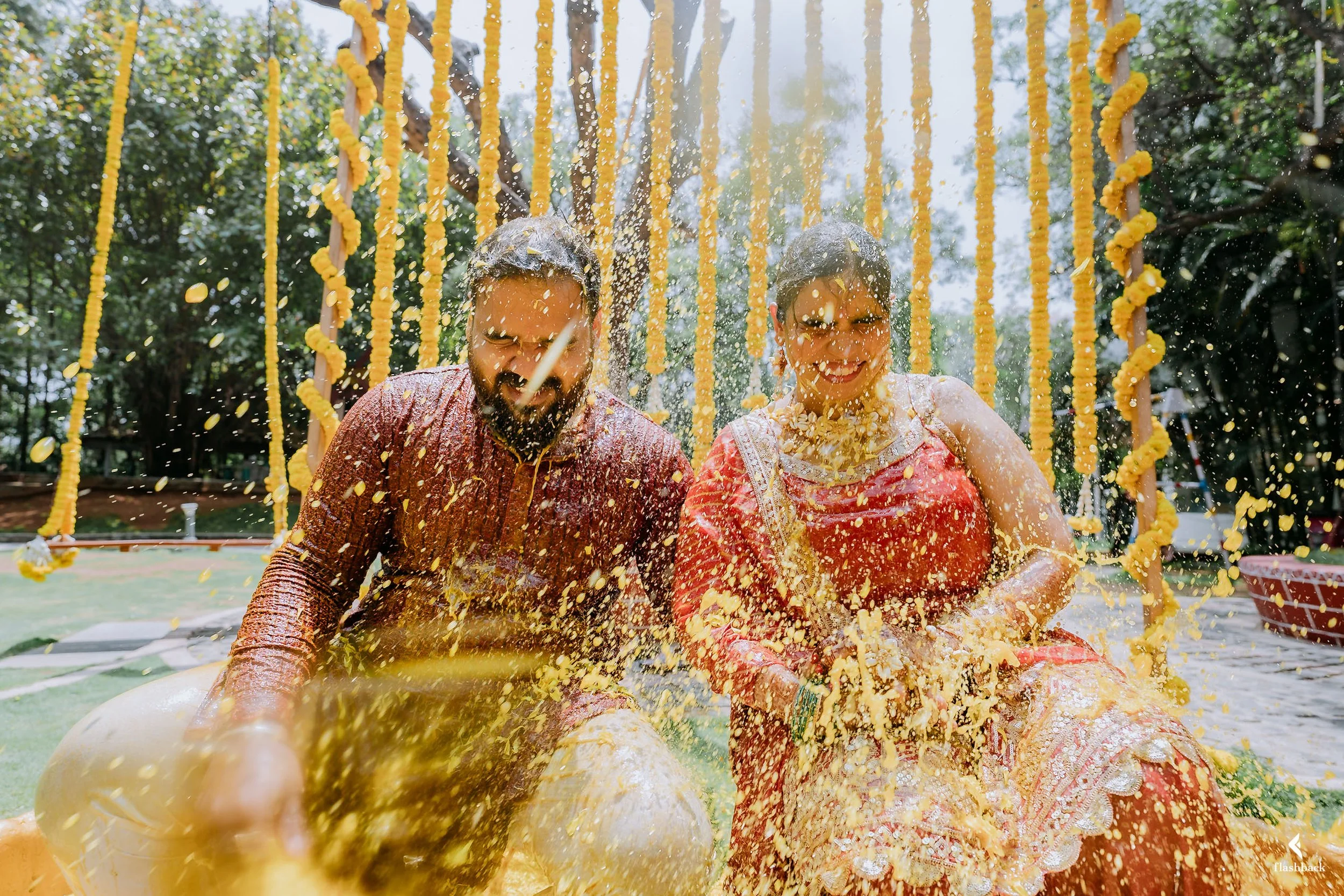 Haldi-couple-indiancouple-wedding-haldi-water-fun-haldi-outfit-watershower-bride-groom.jpg