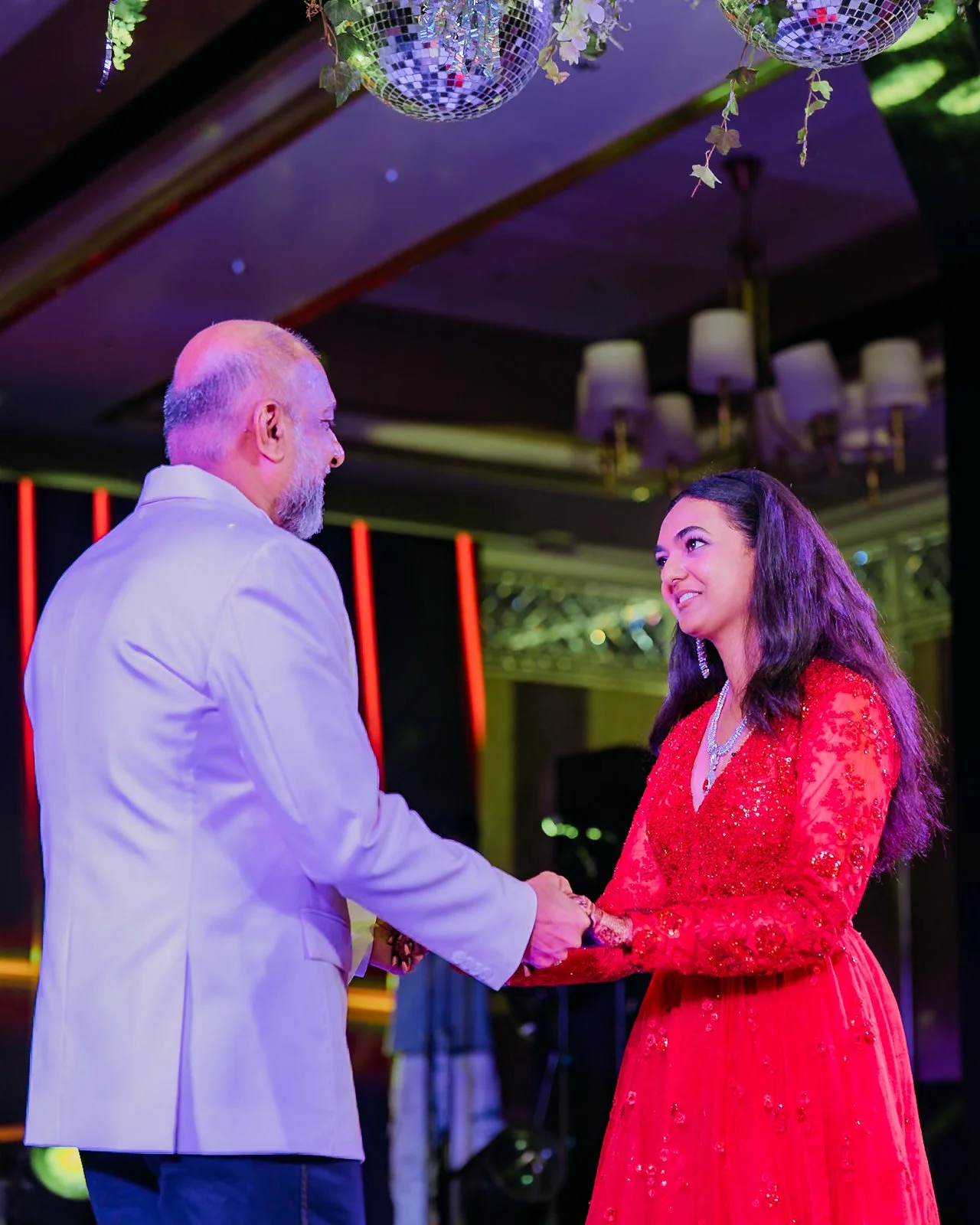 Shrishti dancing with her father at the cocktail