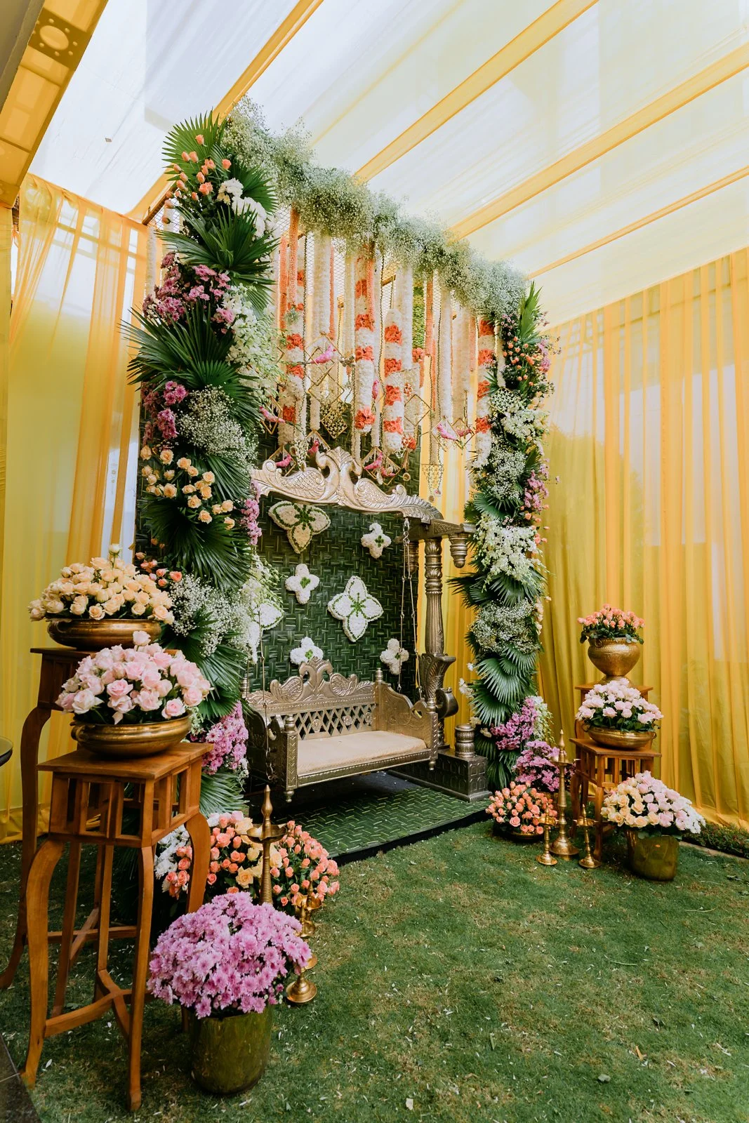 Floral swing set up in the garden for Shrishti's haldi