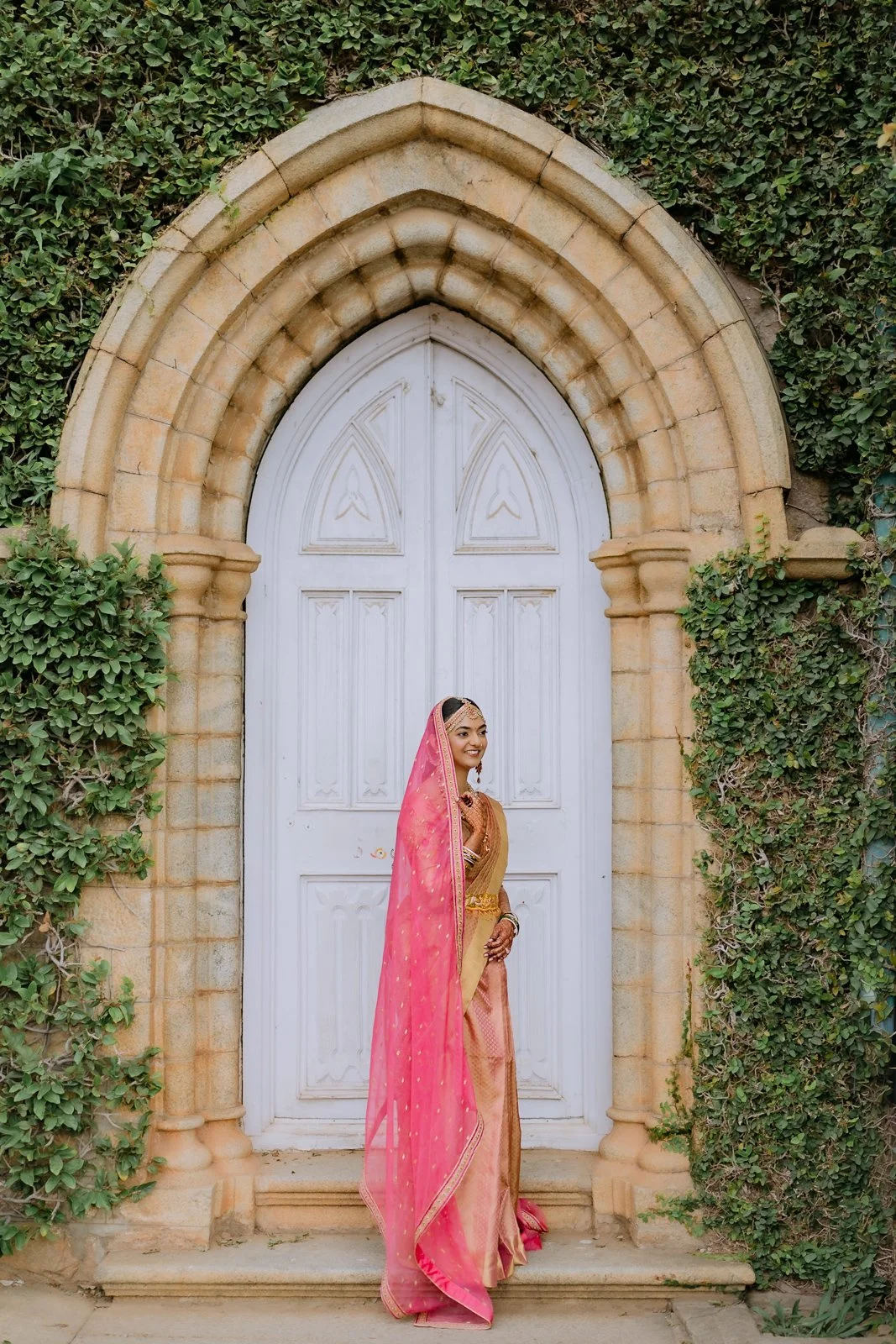 Shrishti alone at an arched doorway of Bangalore Palace