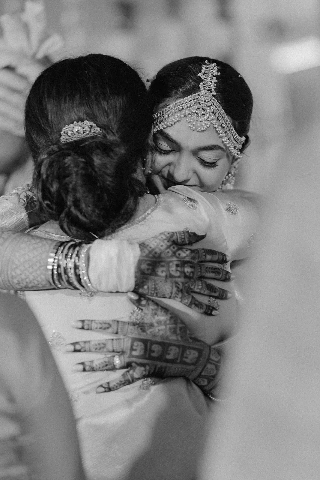 Shrishti hugging a loved one after the wedding, black and white