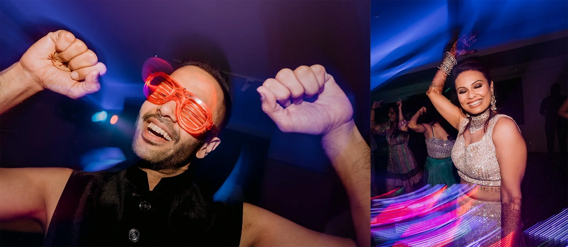 A man wearing red shutter shades glasses and a woman in traditional Indian attire dancing and having fun at a party or celebration with colorful lights.