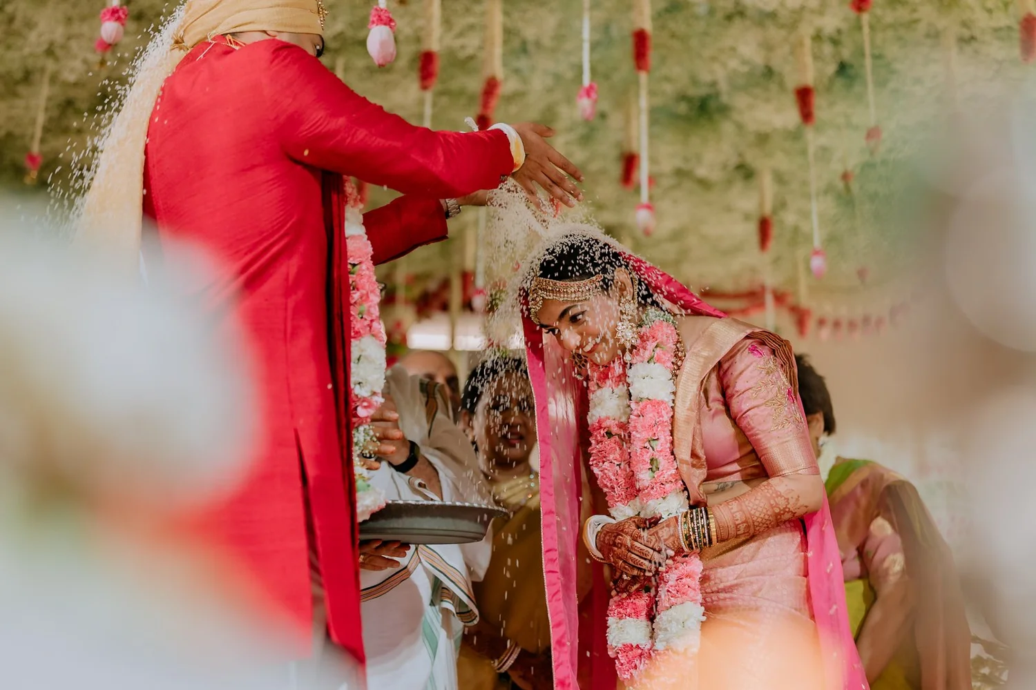 Akhil showering rice on Shrishti during the akshata