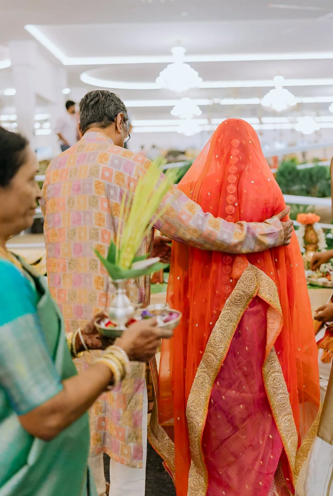Shrishti's veil being adjusted by family