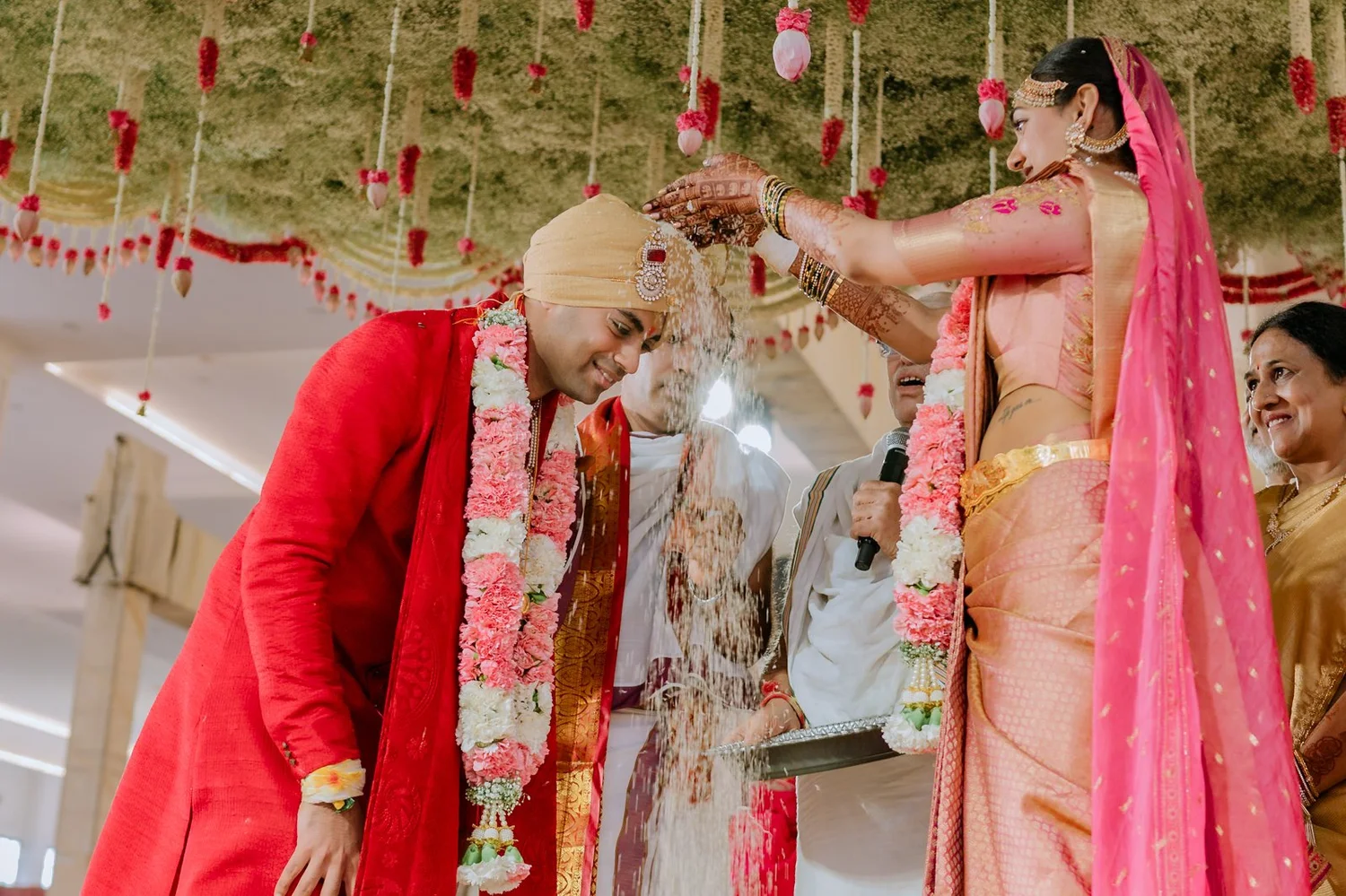 Shrishti garlanding Akhil at the mandap