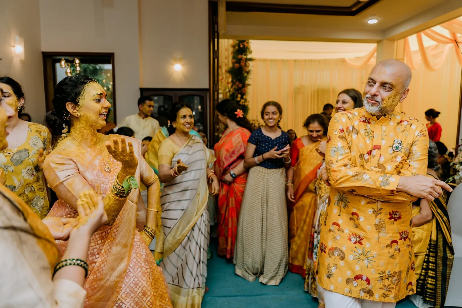 Family dancing in the living room after the haldi