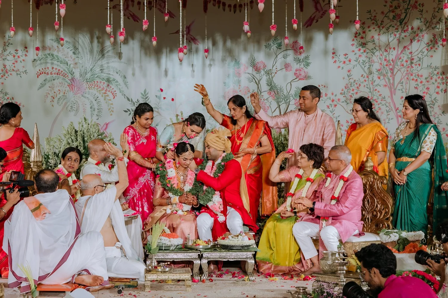Families gathered around the couple during the muhurtham