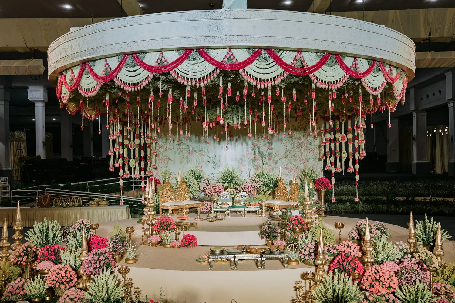 Round floral mandap with hanging garlands inside Bangalore Palace