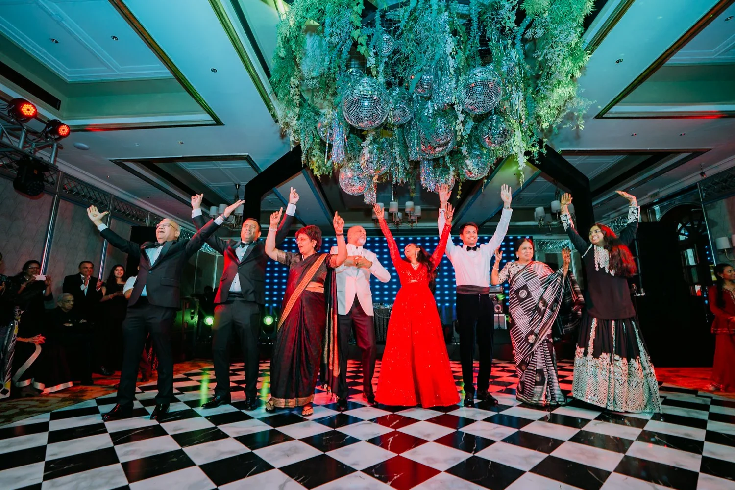Both families dancing together on stage