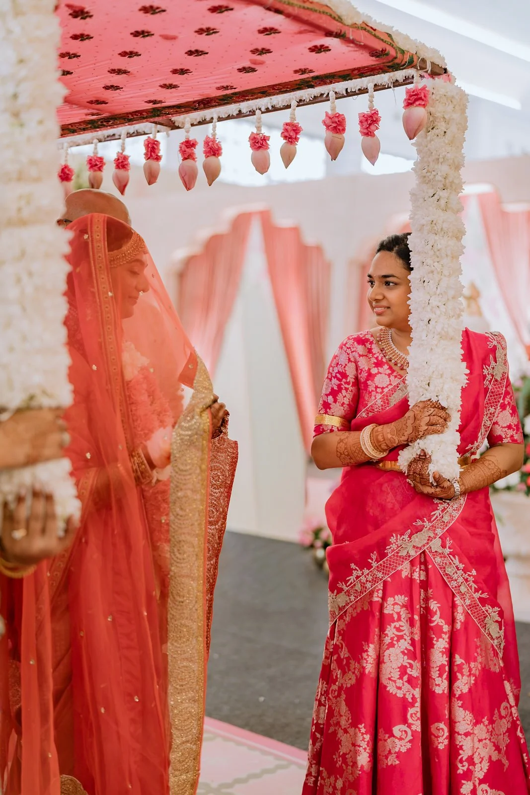 Shrishti smiling as she is led beneath the canopy