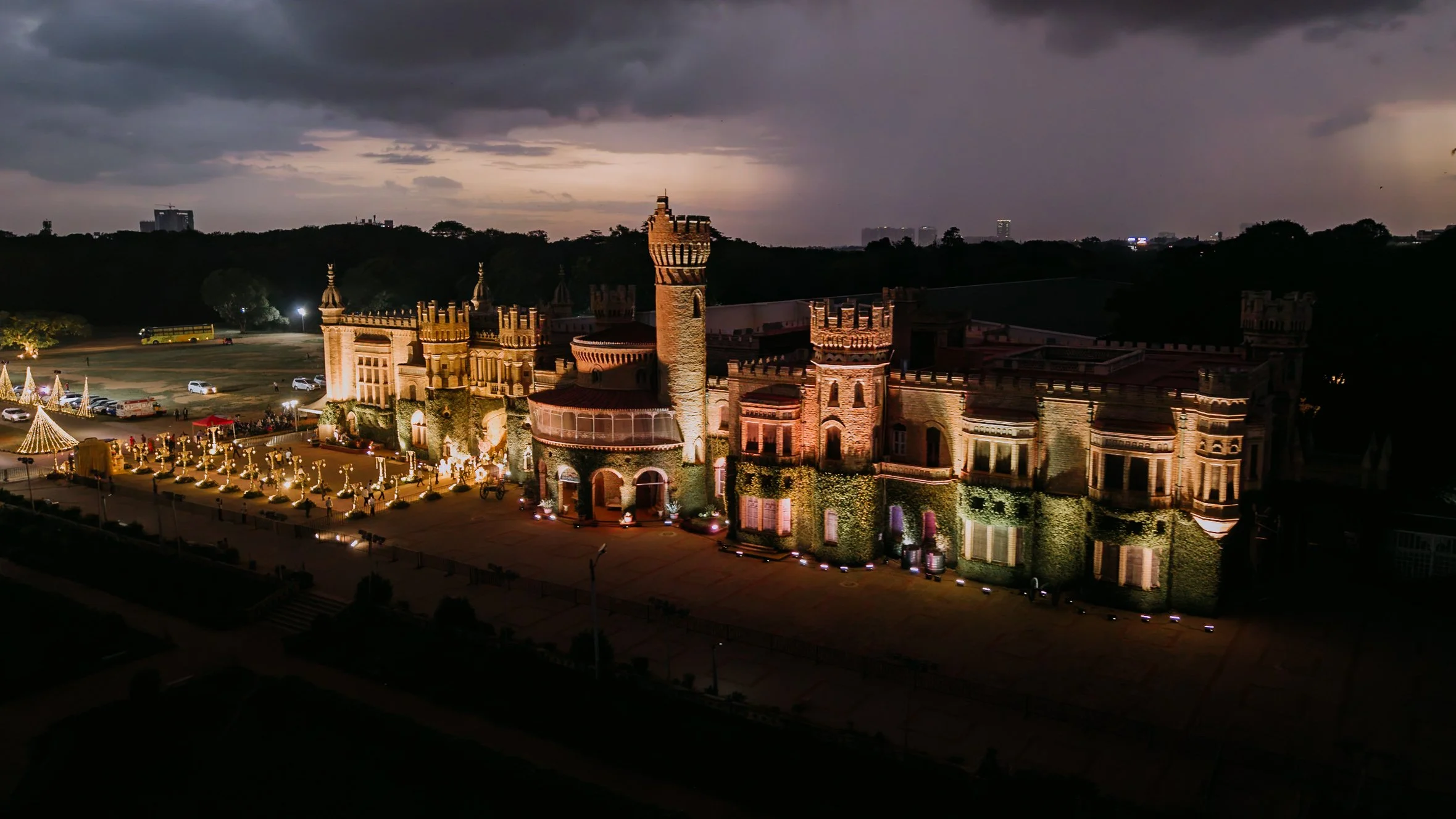 Aerial view of Bangalore Palace lit up at dusk for the wedding