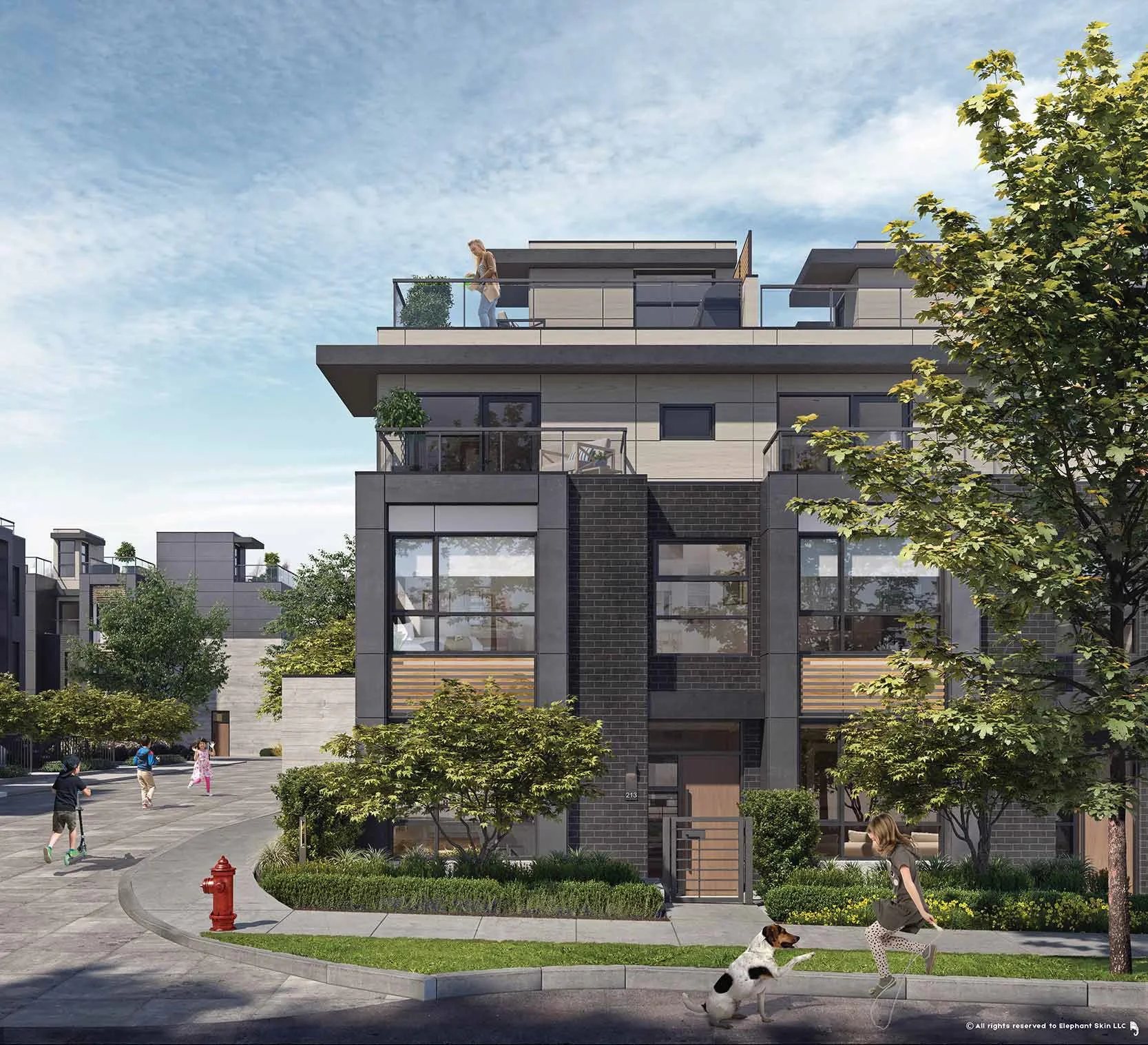 Modern multi-story residential building with large windows, balconies with glass railings, and lush greenery. Children are playing outside, and a woman is walking her dog. The sky is partly cloudy.