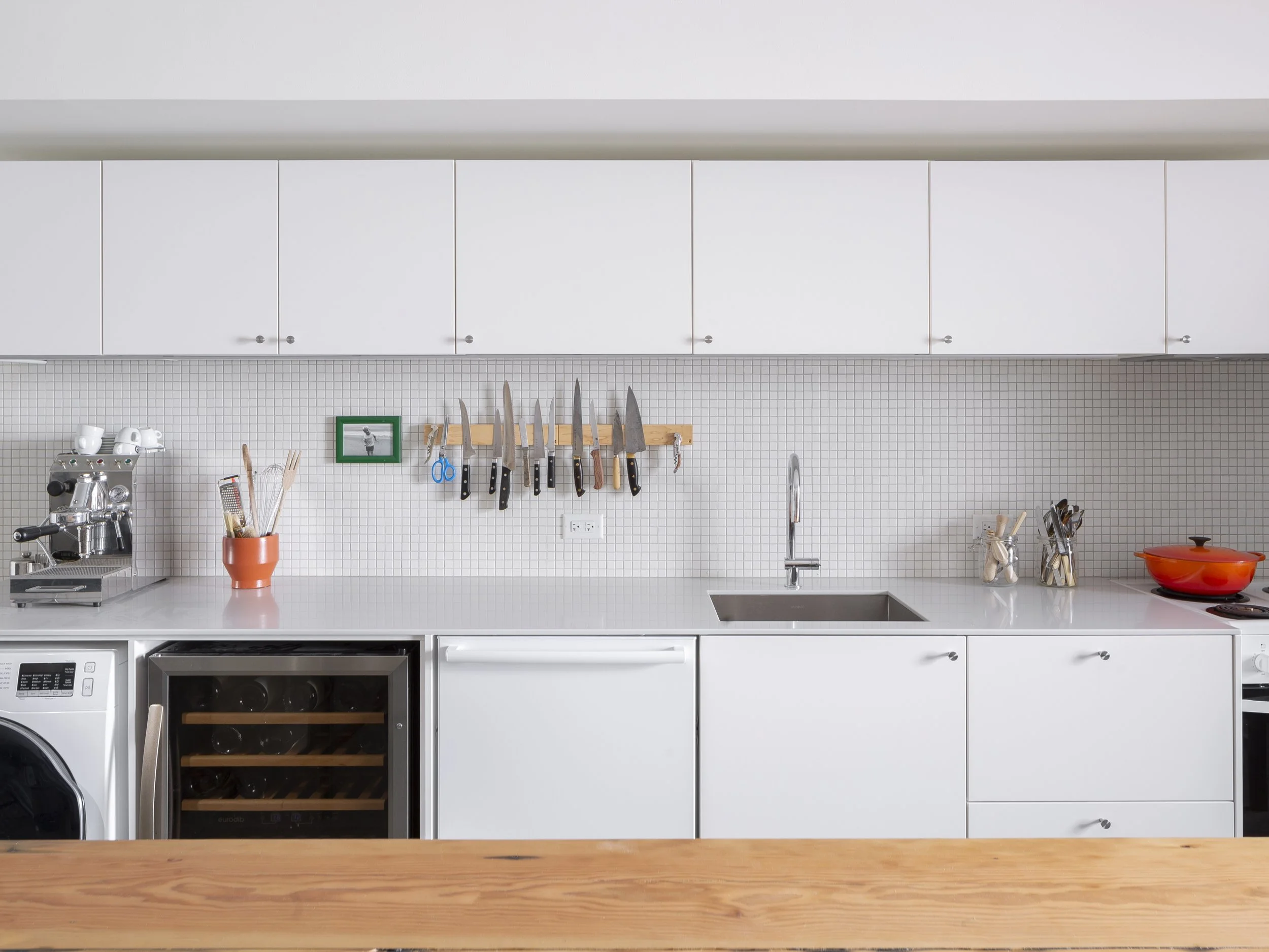 North basement unit of Bonnie Doon Duplex multi-family project in Bonnie Doon neighbourhood of Edmonton, Alberta, showing use as kitchen studio