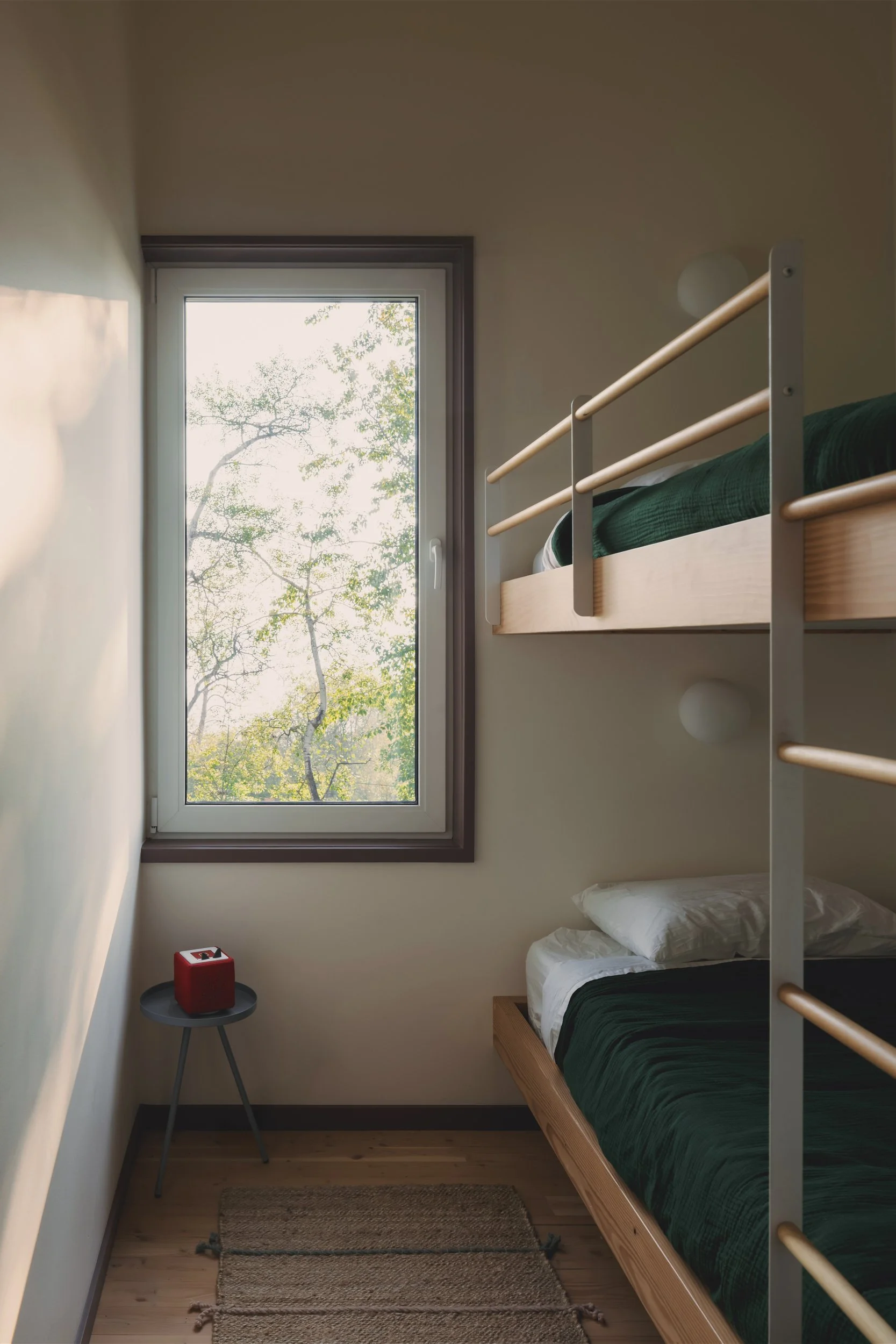 Bedroom of architectural cabin at Wabamun, Alberta near Edmonton showing custom built-in bunkbeds