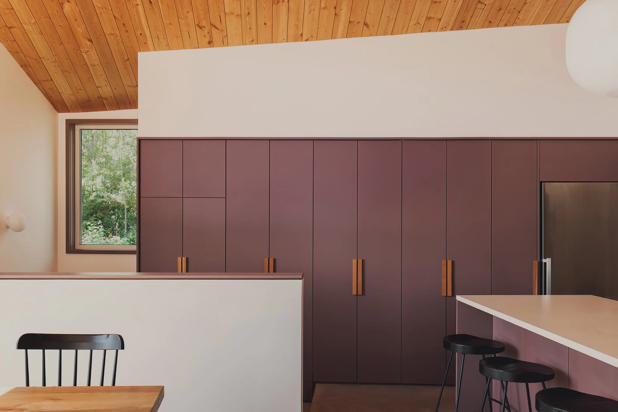 Interior kitchen cabinets and entry of architectural cabin at Wabamun, Alberta near Edmonton