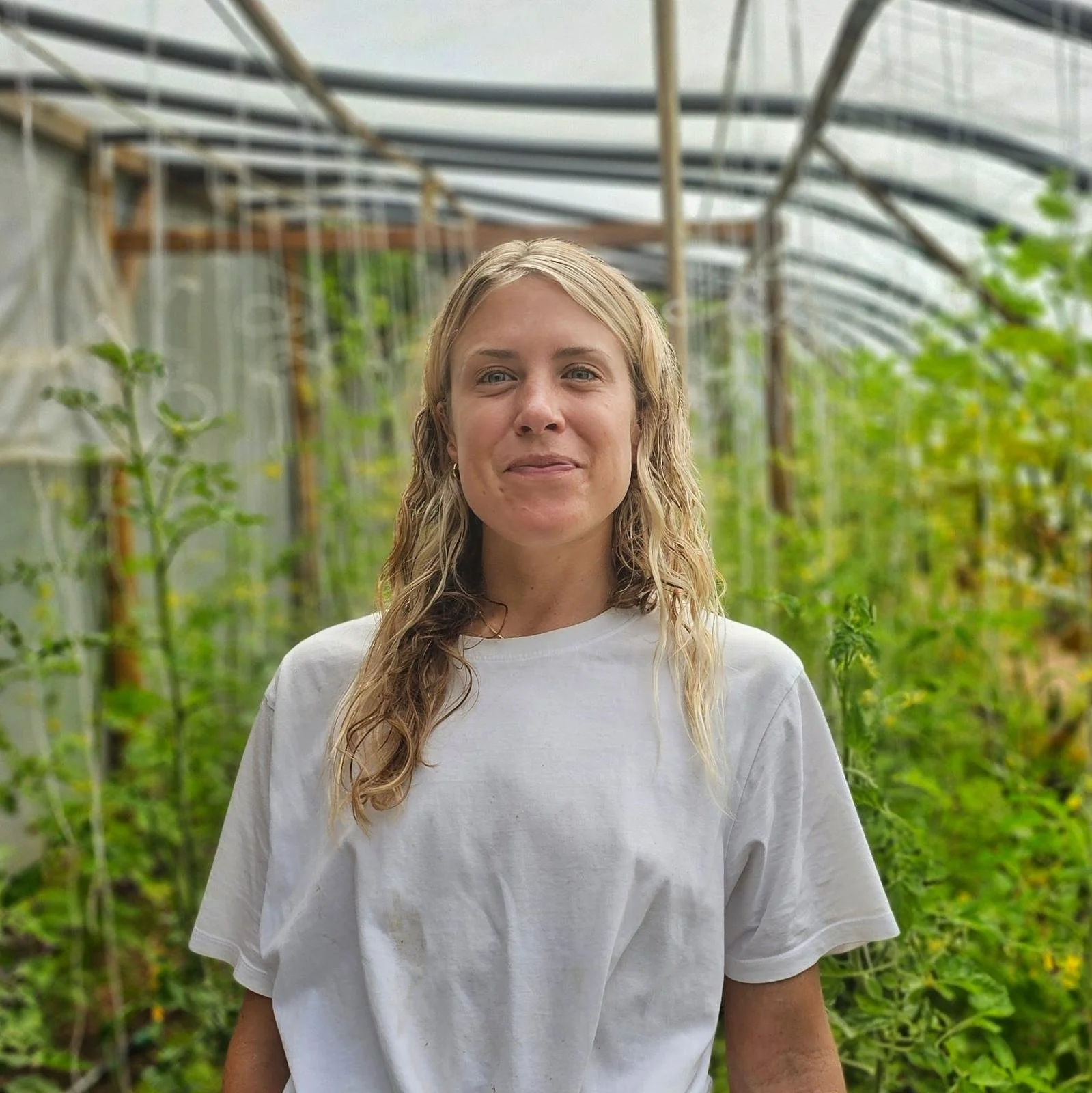 A woman with long blonde hair smiling