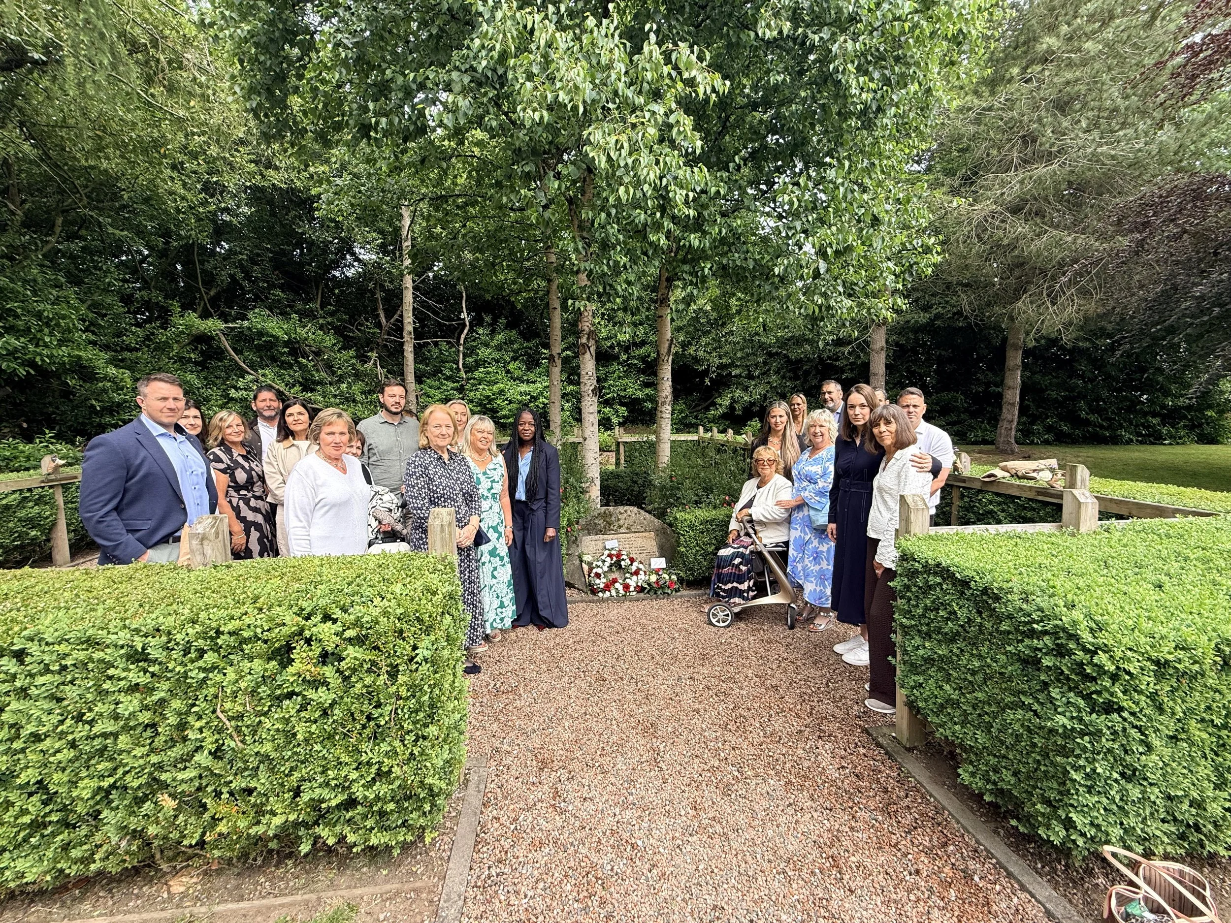 families gather in front of memorial to victims of RAF 1194 Chinook crash