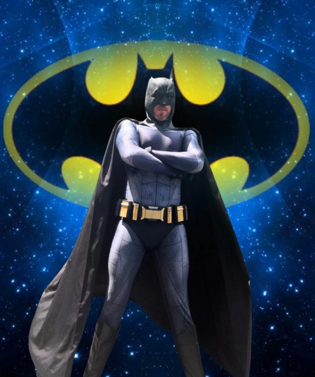 Batman-inspired superhero character performer at a children’s birthday party.