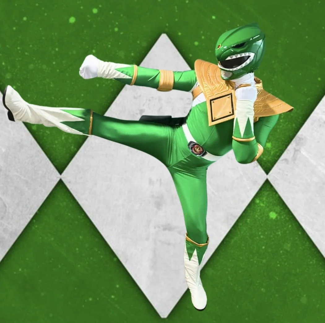 Green Power Ranger-inspired superhero character performer at a children’s birthday party.