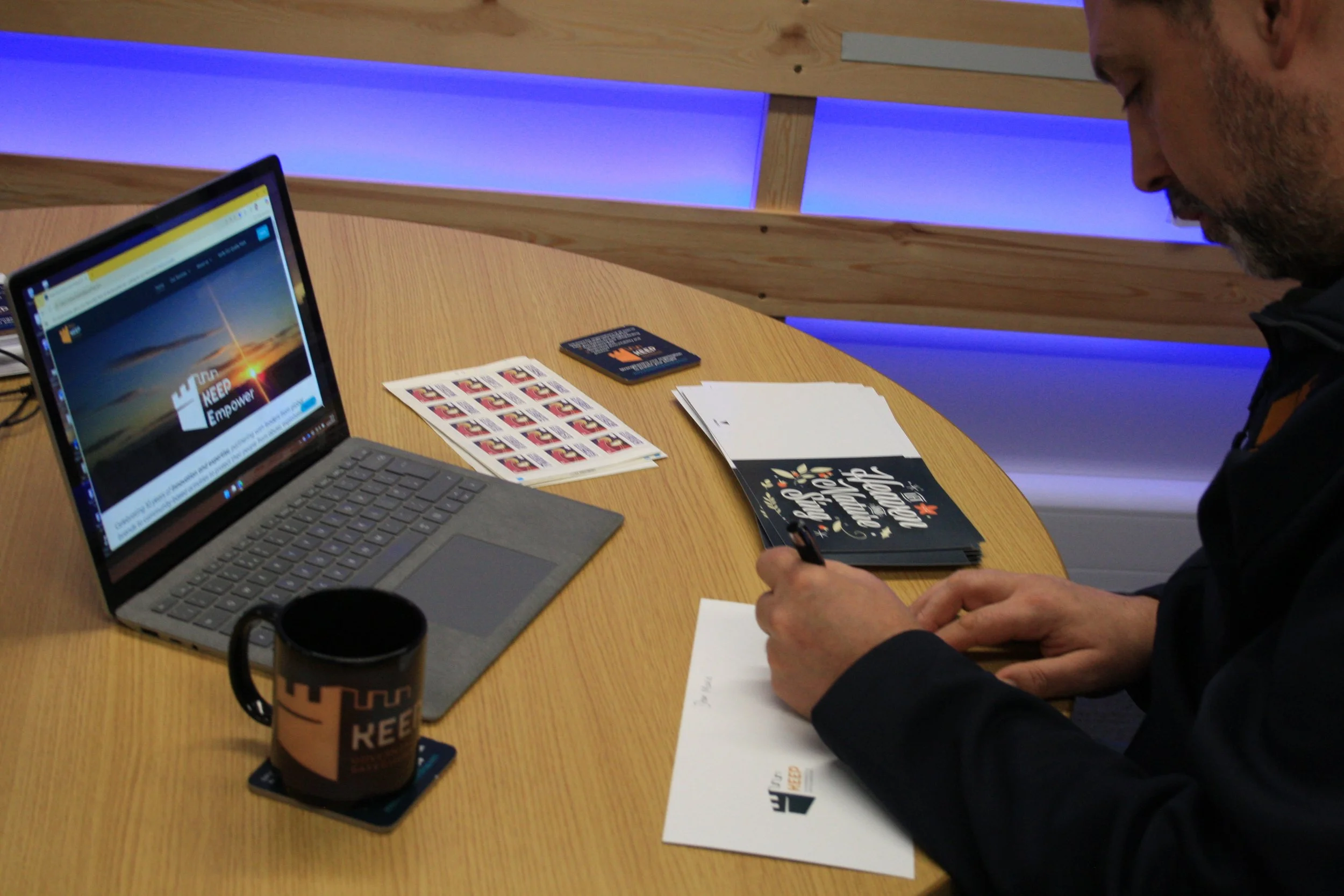 Our director, Andy, signing Christmas cards for our clients 