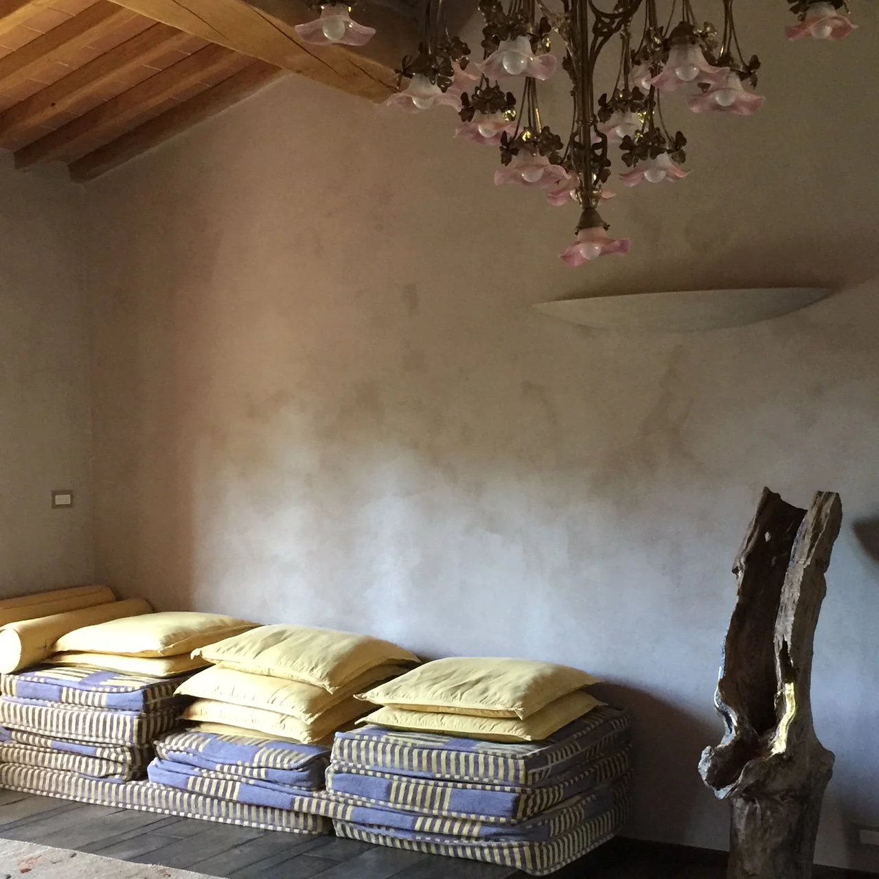 Grey lime plaster and restored beams