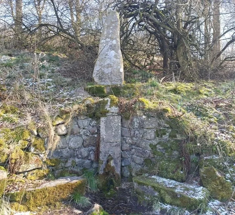 A sacred spring. With a stone front.