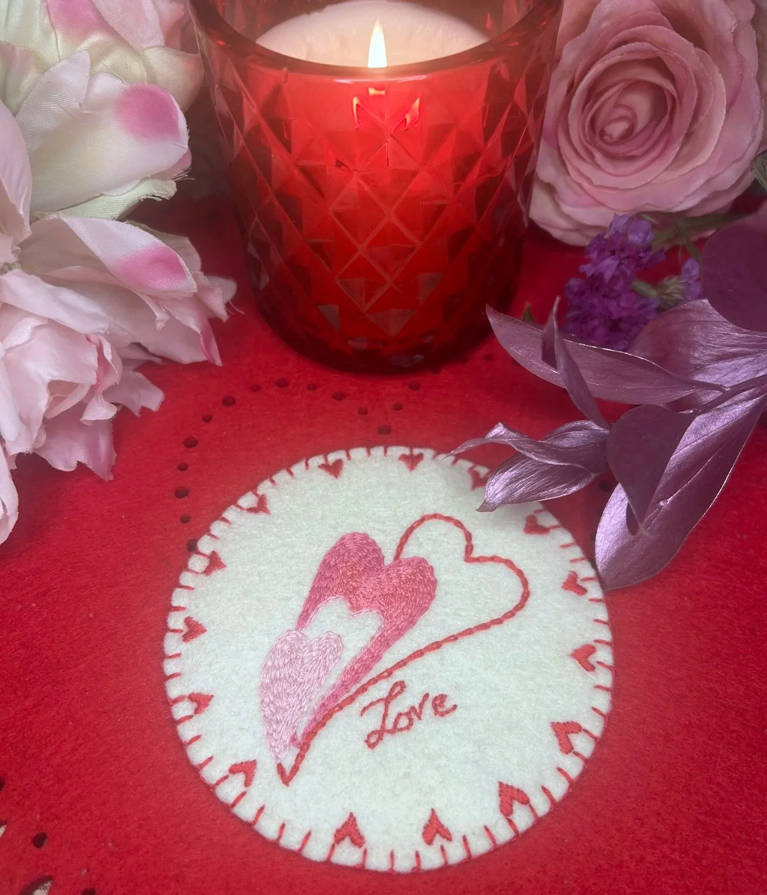 Handmade embroidered Trio Heart coaster with three overlapping pink and red hearts, ‘Love’ stitching, on cotton and felt, romantic home decor gift for Valentine’s Day, anniversaries, or weddings