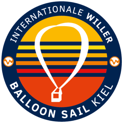 Logo of Internationale Willer Balloon Sail Kiel featuring a hot air balloon shape with horizontal gradient lines in yellow, blue, orange, and red, and circular text around it.