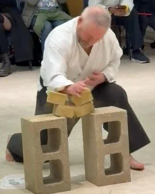 Dave chopping two bricks as part of his 2nd Dan Grading