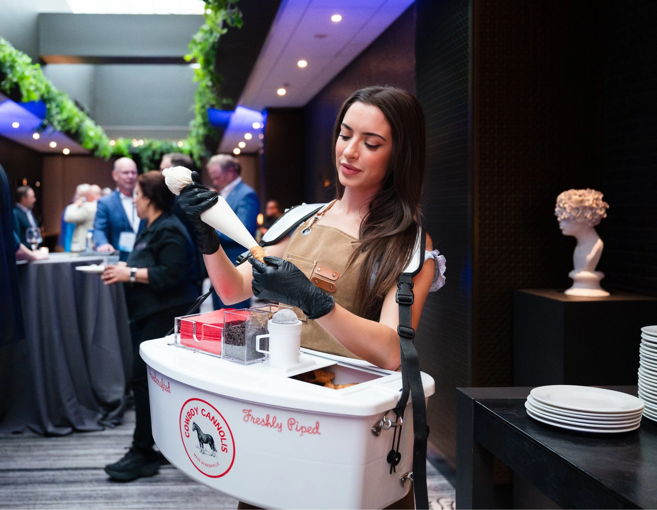 Cowgirl making cannolis at an event at the Loews hotel in Nashville TN