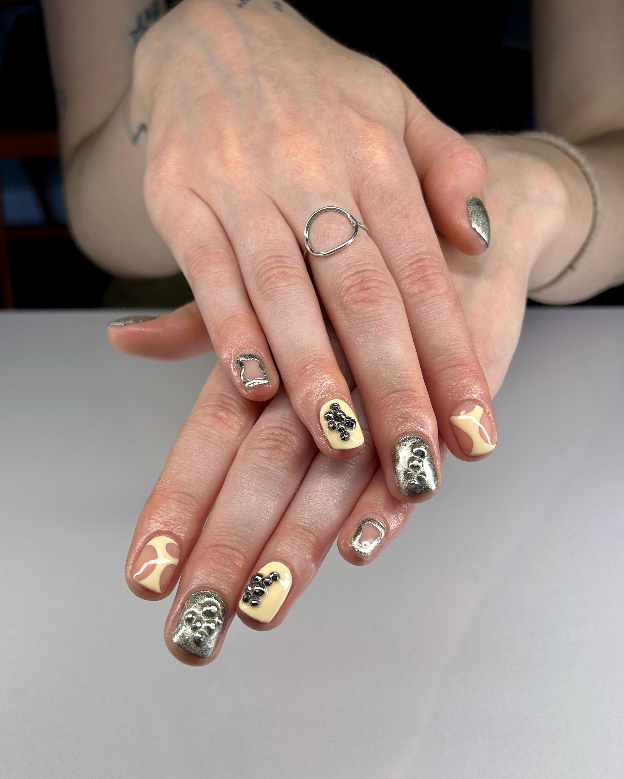 1-Butter-and-chrome-gel-polish-with-different-designs-on-each-fingers.jpeg