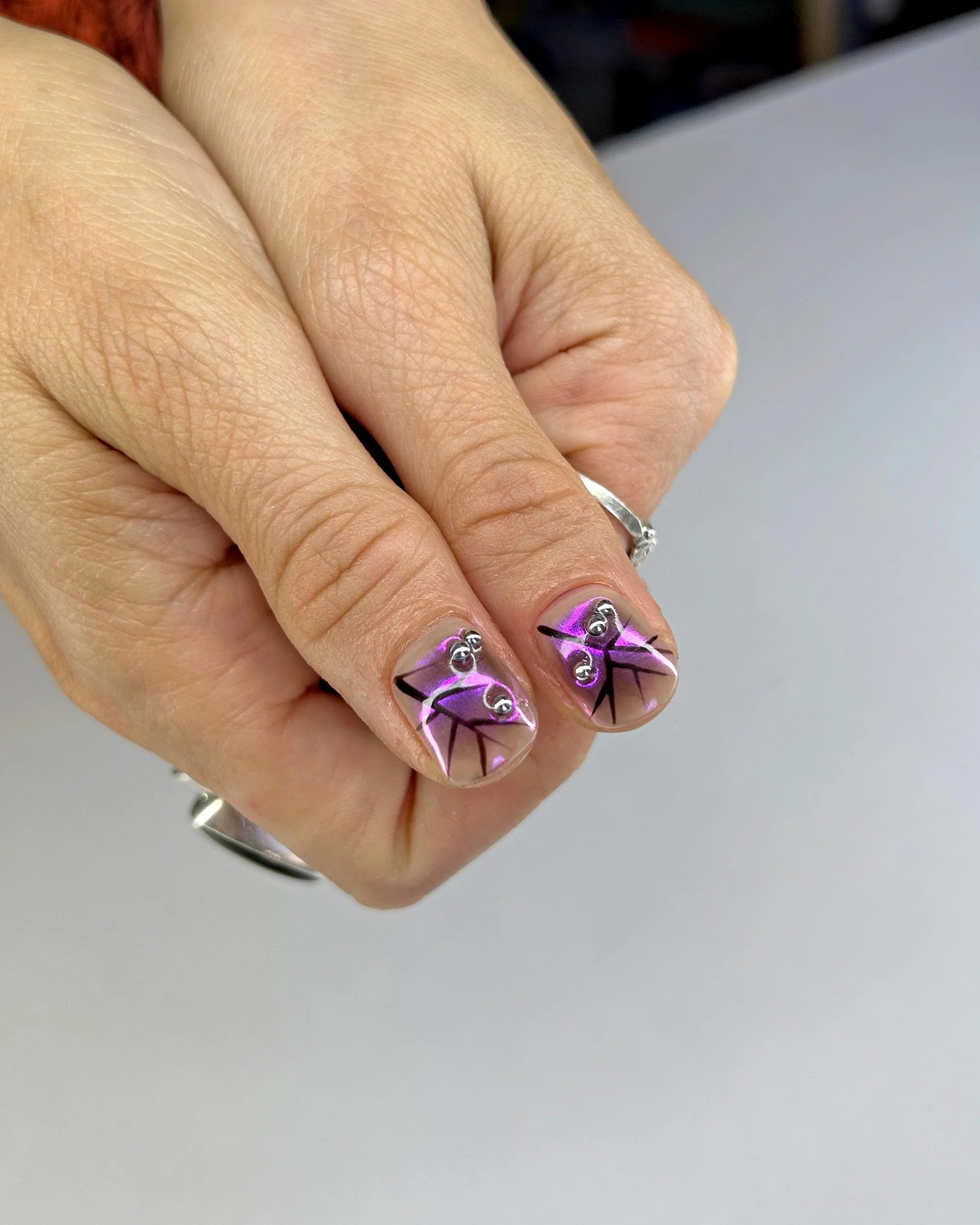 Thumbs-iridescent-purple-with-nail-art.jpg