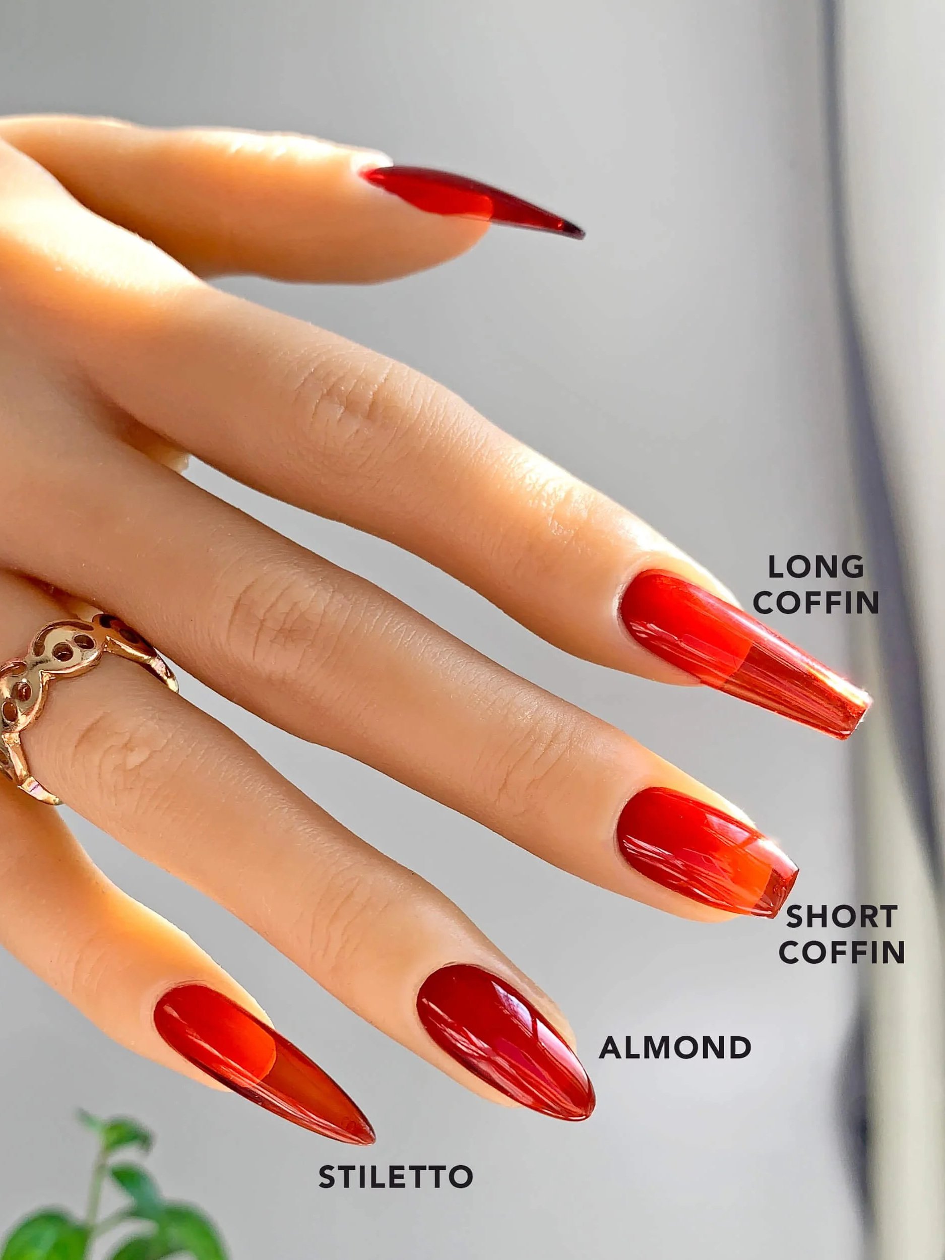 Red Jelly press-on nails shown on a mannequin hand in different styles and lengths.