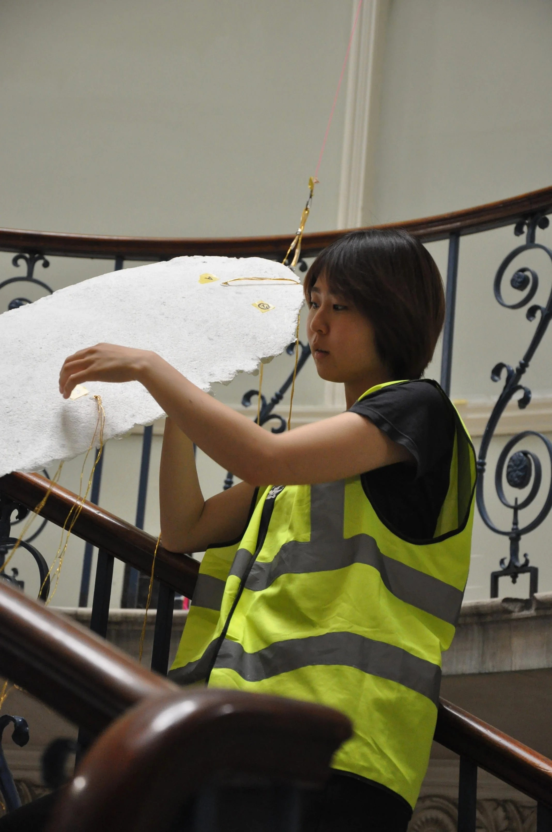 Anon installing paper clouds.jpeg