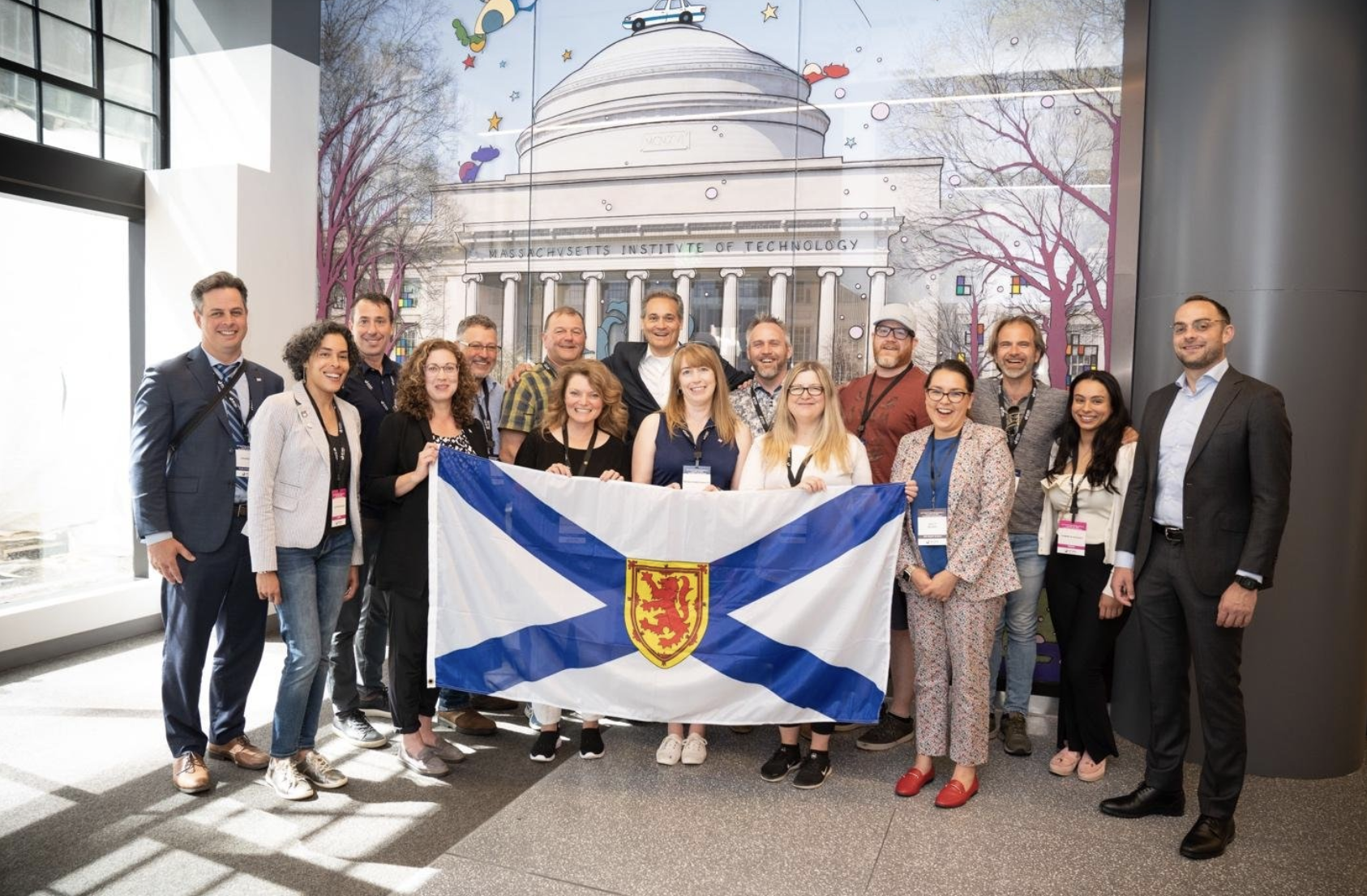Image of the MIT Reap Focus Nova Scotia 2021 team holding the Nova Scotia flag