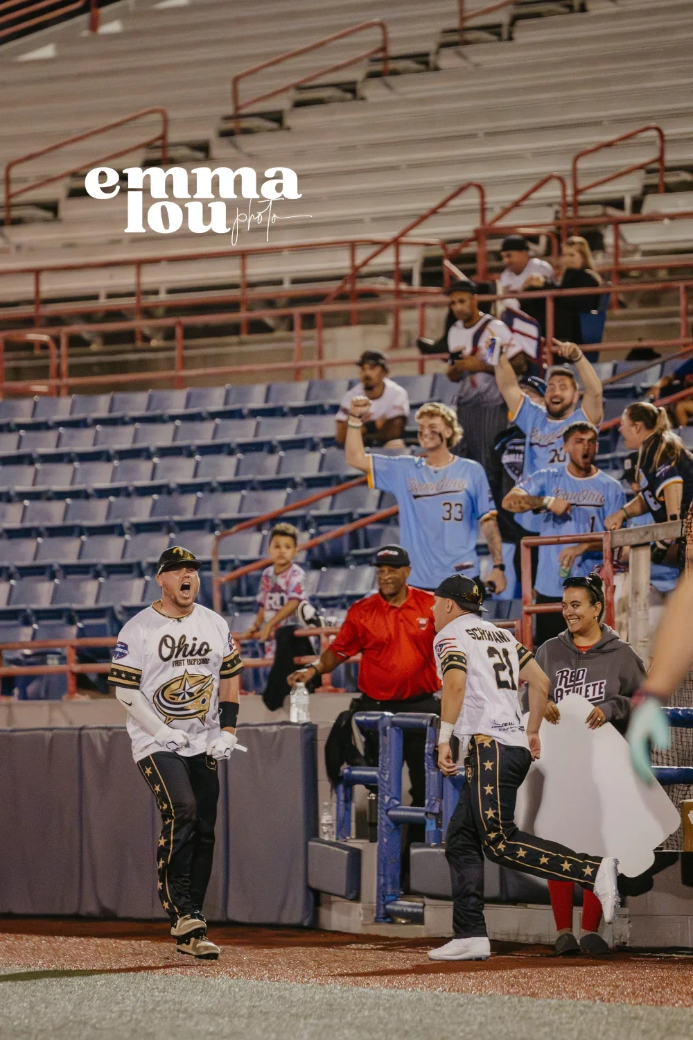 Ohio First Defense player Butara number 0 making contact with softball at USSSA Challenge Cup with Space Coast scoreboard and field visible in background